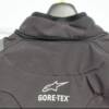 Leather protection panels have been positioned on shoulders,  with reflective material above. YKK zipper for Windstopper collar also seen here. A-Stars logo and Gore-Tex emblems are also reflective.