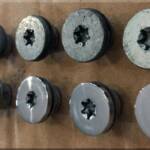 Before and after shot of the rotor bolts. 
I wrapped the threads in electrician's's tape to protect them, then inserted into a drill chuck. Sanded with 220, 400, 600, 800 then polished with Autosol.

