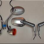 2003 stock V-Rod mirrors & signal lights on the left are being switched for the 2015 V-Rod Muscle mirrors with built in LED turn signals for a cleaner look.